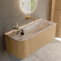KURVE-DLUX 115cm badmeubel ronding Links kleur Oak met 1 lade en 1 deur. Wastafel BIG SMALL Rechts zonder kraangat Nata.